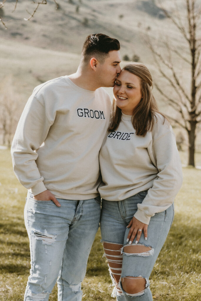 Outdoor Engagement in Colorado Couple Wearing Bride Groom Sweatshirts | Julia Susanne Photography