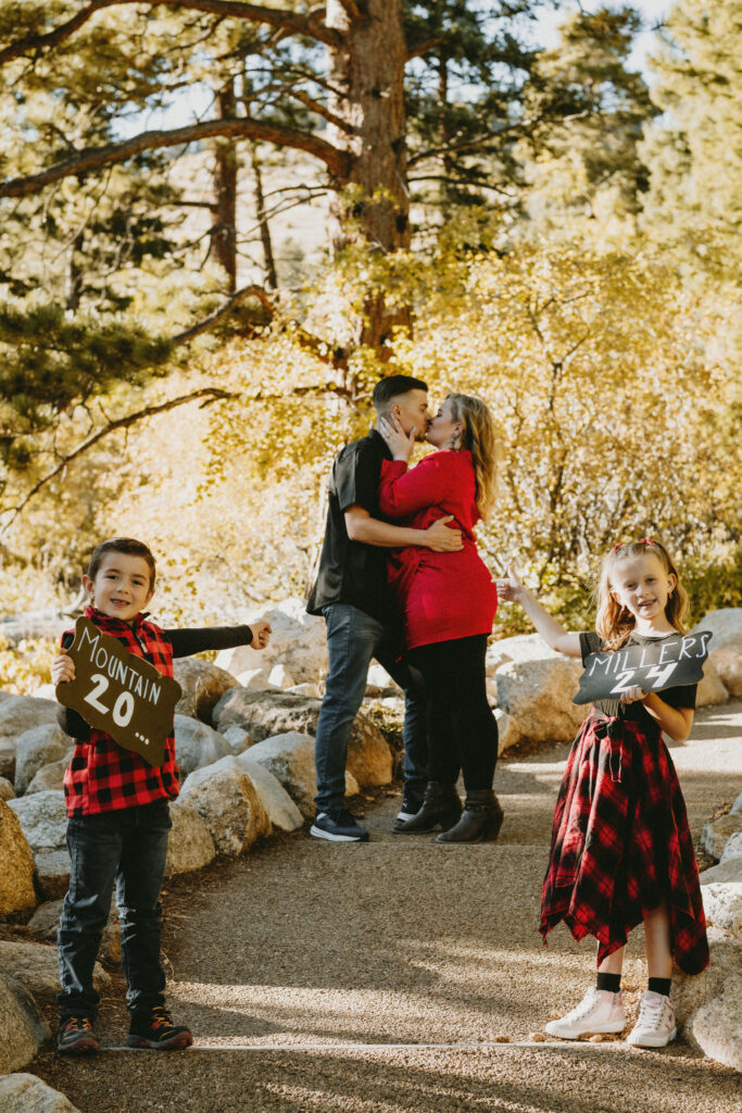 Outdoor Engagement in Colorado Couple Children with Save the Date Signs | Julia Susanne Photography